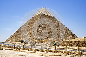 Giza, Egypt - May 20, 2019 : The Pyramid of Chephren and a road in the fields of the great pyramids of Egypt